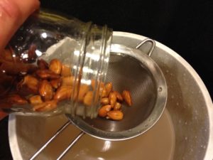 Draining almonds in a sieve